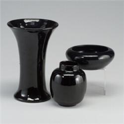 Three PETERS AND REED mirrored black vases. Scratches to all three, spiderlines to base of talles...