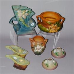 Seven ROSEVILLE pieces: brown Water Lily 4" planter; blue Clematis 6" fan vase; brown Magnolia 4"...