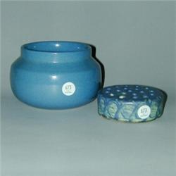 Two PETERS AND REED pieces, a glossy blue bowl and Chromal Ware flower frog. Glaze flaking to bas...