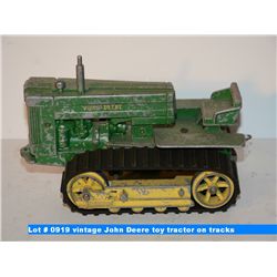 vintage John Deere toy tractor on tracks