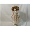 Image 2 : PORCELAIN DOLL IN FLORAL APRON DRESS