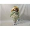 Image 1 : PORCELAIN DOLL IN LIGHT GREEN DRESS WITH STAND