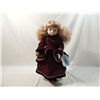 Image 1 : PORCELAIN DOLL IN VELVET WINTER DRESS