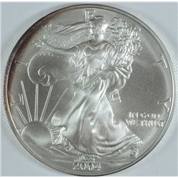 2004 AMERICAN SILVER EAGLE, GEM UNC   SOME TONING.