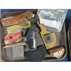 TRAY OF HOLSTERS