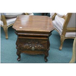 A single drawer semi-contemporary end table with carved panels