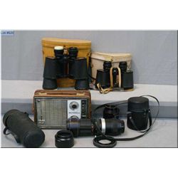 Three pairs of binoculars including a Carl Wetzlater 10 X 50, camera lenses and a portable radio