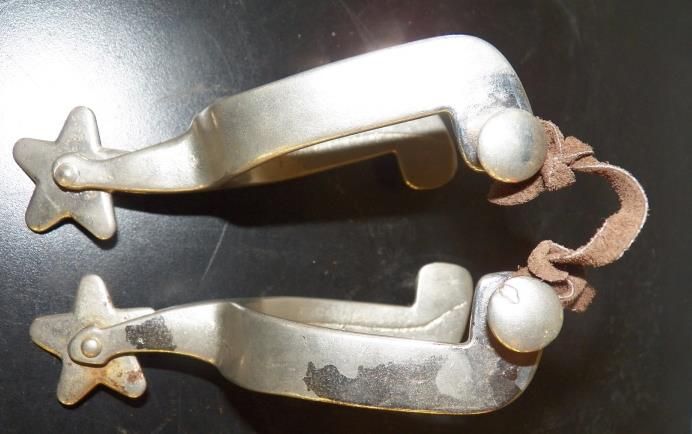 Pair of Marked North and Judd Spurs with 5 Point Star Rowels with Straps
