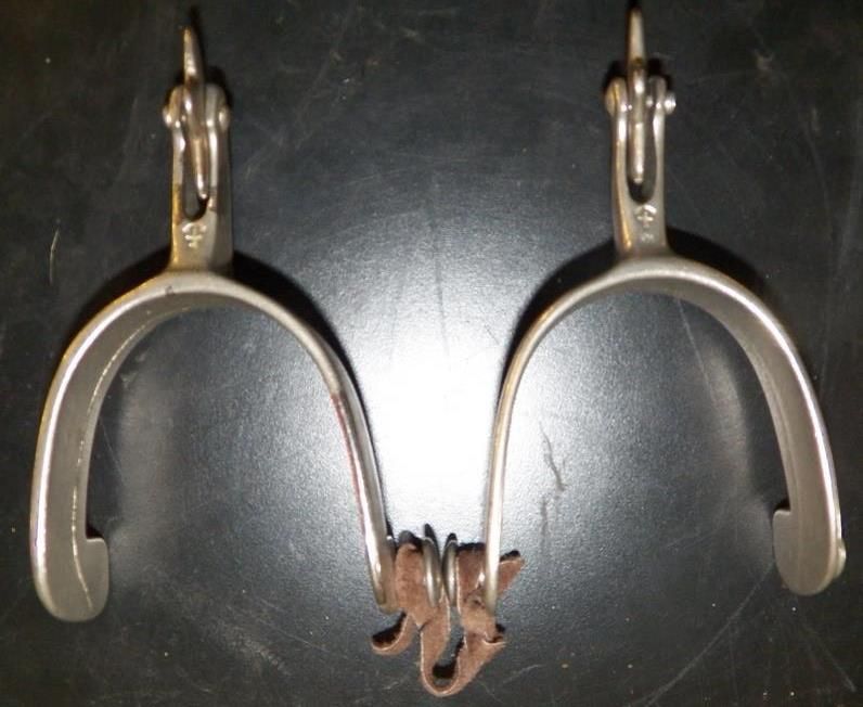 Pair of Marked North and Judd Spurs with 5 Point Star Rowels with Straps