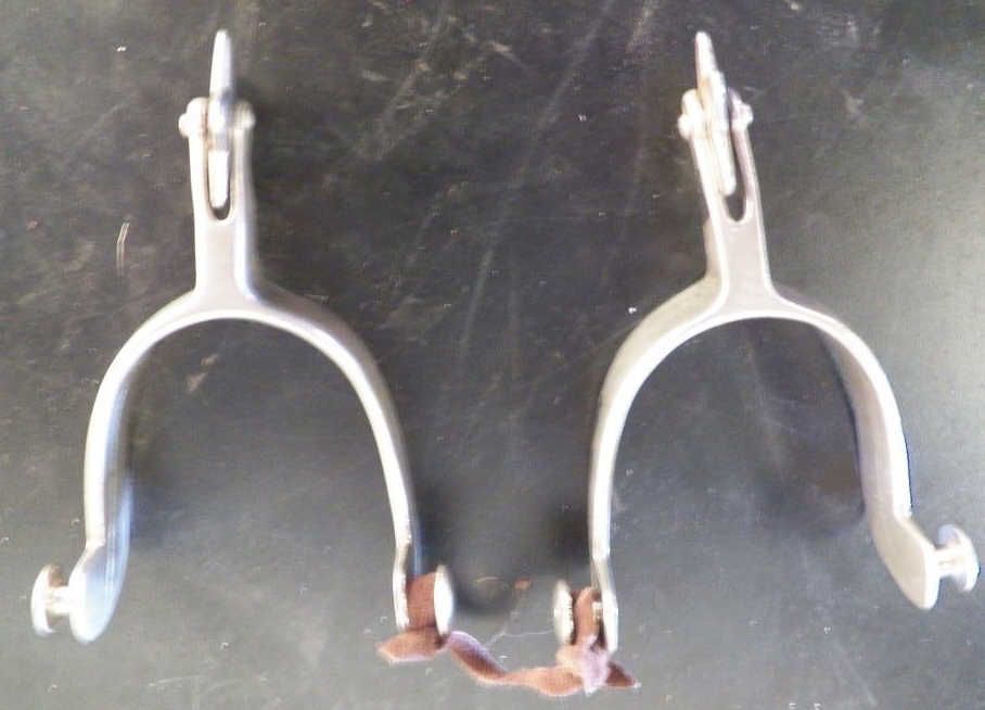 Pair of Marked North and Judd Spurs with 5 Point Star Rowels with Straps