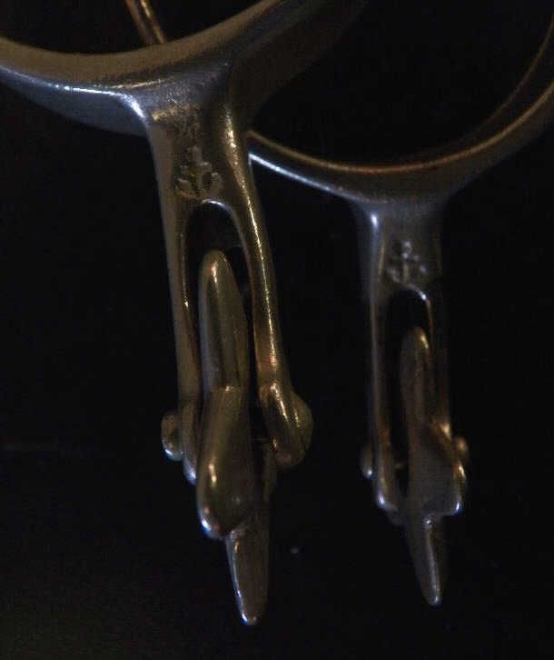 Pair of Marked North and Judd Spurs with 5 Point Star Rowels with Straps