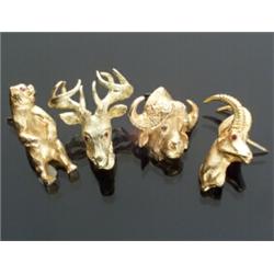 Three 10-Karat and One 18-Karat Yellow Gold Ruby Eye Animal Head Tie Tacks...