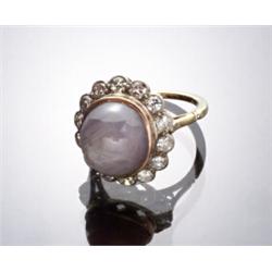 Tested 14-Karat Yellow and White Gold, Blue-Gray Star Sapphire and Diamond Dinner Ring...