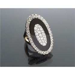 18-Karat Yellow and White Gold, Diamond and Black Onyx Dinner Ring...