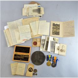 A collection of ephemera and WWI service medals