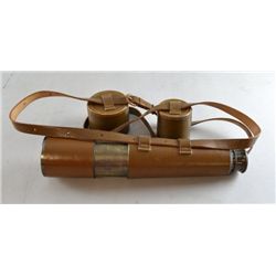 A four draw telescope in attached leather case with