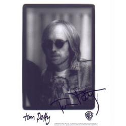 An 8 x 10, B&W promo photograph hand signed by Tom Petty.…