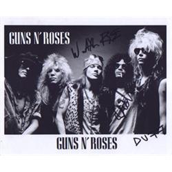  An 8" x 10", B&W photo of Guns N' Roses,  hand signed by Axl Rose, Slash and Duff.  A Great coll…