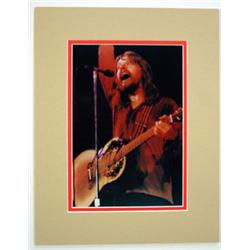 An 8" x 10" color photo, hand signed by Bob Seger.  Double matted to 11" x 14".…