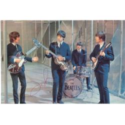 Color Magazine photo,approx 9x 7 signed in ink by John Lennon.Autograph was obtained in May 1975 …