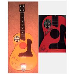 A nice condition Beatles New Beat plastic guitar. Made by Selcol (Uk) red and orange plastic whic…