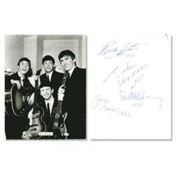 Beatles Photo Signed By All Four. A b/w photocard signed on the reverse by all four Beatles.  C.1…