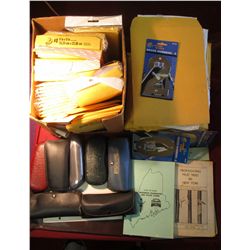 52. (3) Coin pages; BU tton & Bolt???; & a tub of wrapping & packaging supplies.