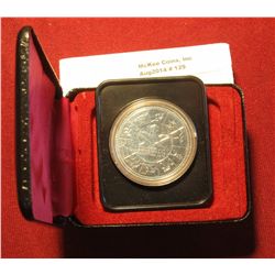 129. 1978 XI Commonwealth Edmonton Games Canada Silver Prooflike Dollar. In original Royal Canadian 
