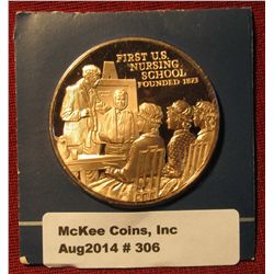 306. "First U.S. Nursing School Founded 1873" Proof Bronze Medal. 1 1/2" diameter. In original holde