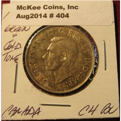 404. 1945 Canada Silver Half Dollar. Choice BU . Attractive green and gold toning.
