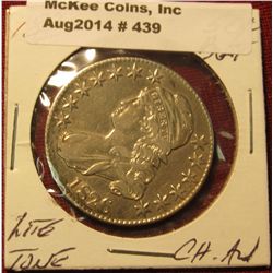 439. 1826 Capped BustHalf Dollar. Choice AU. Light peripheral toning.