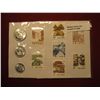 Image 1 : 890. Souvenir sheet of 3 coins and 7 stamps from China. Coins look BU , stamps are unused