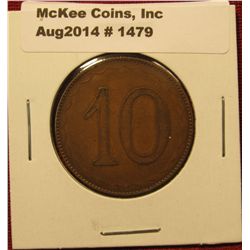 1479. Old bronze gaming token with “10” on one side and the four suits of cards on the other