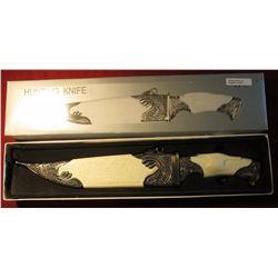 1597. # 42501 Hunting Knife with engraved blade and scabbard.