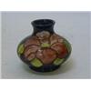 Image 1 : A MOORCROFT SQUAT VASE, tube-lined floral pattern, paper label, height 8cm  30-50...