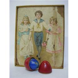 A CUBE PICTURE PUZZLE GAME, c.1910, sixty three pieces, a treen egg, five skittles, spinning top...