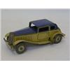 A METTOY TINPLATE SALOON CAR, fawn lower livery, blue roof, clockwork action  30-50...