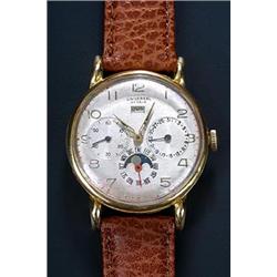 Universal, moonphase chronograph, a gentleman's 18ct gold wristwatch, circa 1940, the silvered di...