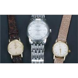 Omega, three lady's wristwatches, a stainless steel round bracelet watch, the silvered dial with...