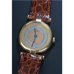 Must de Cartier, a lady's silver-gilt round wristwatch, circa 1990, the three tone mirrored dial...