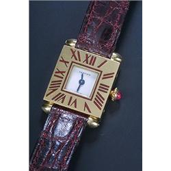 Cartier, a lady's 18ct gold square wristwatch, circa 1970, ref. A102705, the white dial with blue...