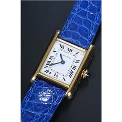 Cartier, 'Tank', a lady's 18ct gold wristwatch, circa 1985, the white dial with black Roman numer...