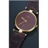 Image 1 : Must de Cartier, a mid size silver-gilt round wristwatch, the maroon dial with baton hands, round...