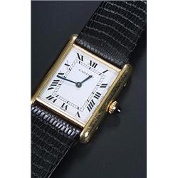 Cartier, Tank, a lady's 18ct gold wristwatch, circa 1980, No. 780866300, the white dial with blac...