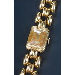 Auvada, a lady's 18ct gold cocktail bracelet watch, circa 1950, the dial with dot and Arabic nume...