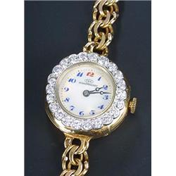 International Watch Company, a lady's 18ct gold and diamond round bracelet watch, circa 1930, the...