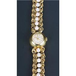 Eterna, a lady's 18ct gold round bracelet dress wristwatch, circa 1950, ref. 4051755, the silvere...