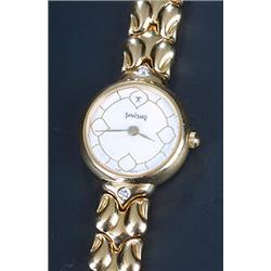 Titan, Tanishq, a lady's Indian 18kt gold round bracelet watch, circa 1990, ref 338AA OIAU, the w...