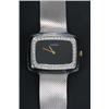 Image 1 : Longines, a lady's 18ct white gold oblong bracelet watch, circa 1970, the black dial with gold ba...
