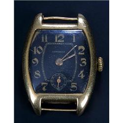 Longines, a gentleman's 18ct gold wristwatch, circa 1920, the black dial with gold Arabic numeral...